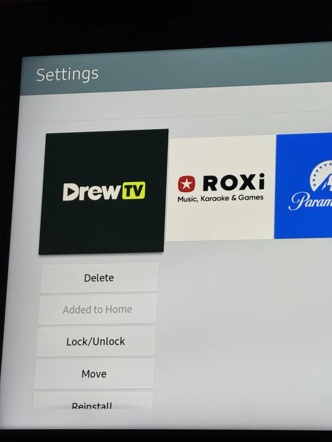 Refined DrewTV wordmark on a dark green tile in Samsung’s Apps menu